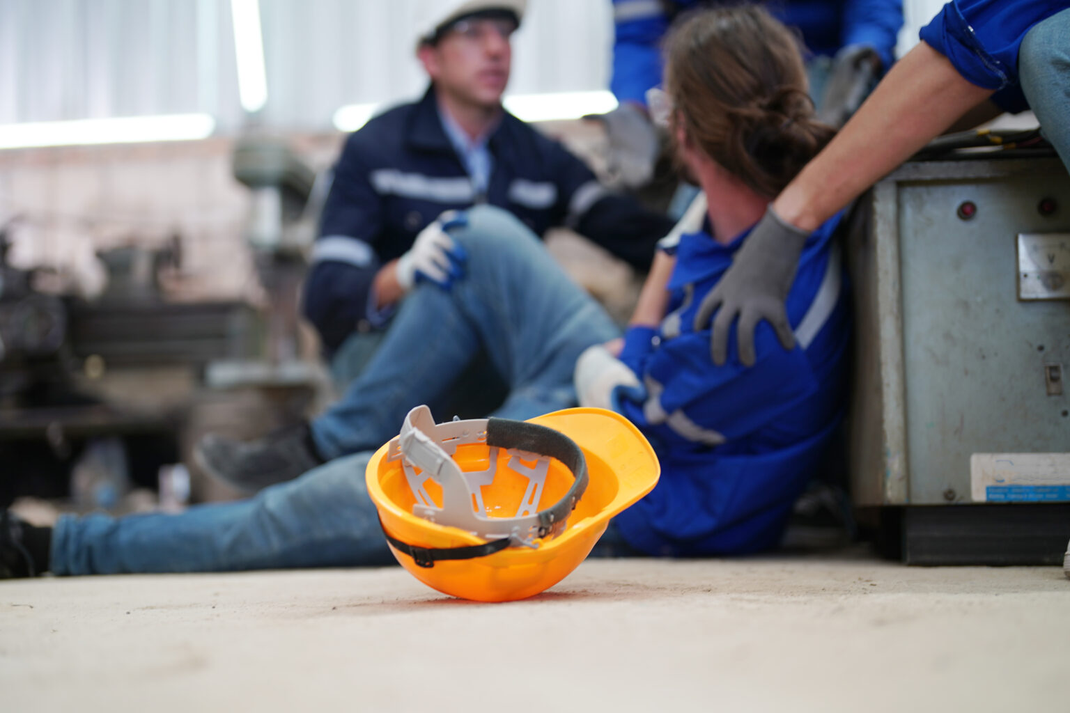 Worker receiving industrial injury in factory